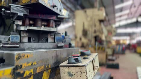 an industrial bending machine in a large factory hall