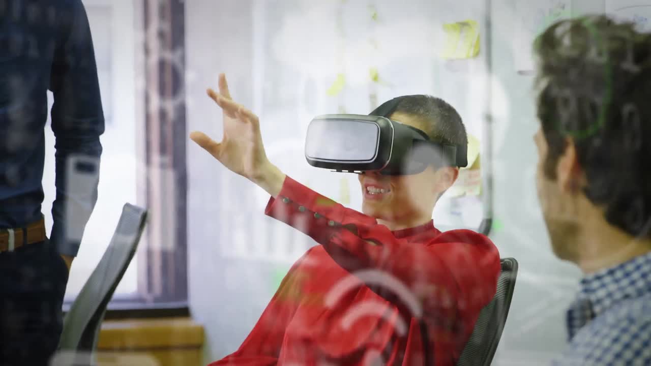 Animation of social media icons and data processing over mixed race woman wearing vr headset