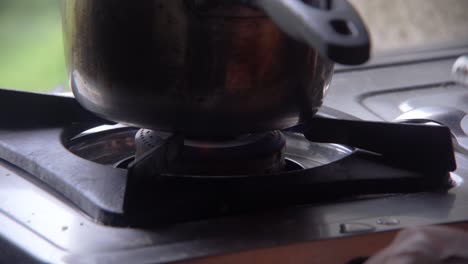 lighting up the stove in kitchen india for tea