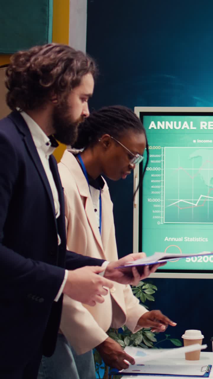 Business Team Analyzing Annual Report Documents in Office