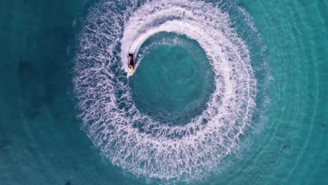 Jet skiing in circles in the Indian ocean. Powerful jet ski. Medium shot