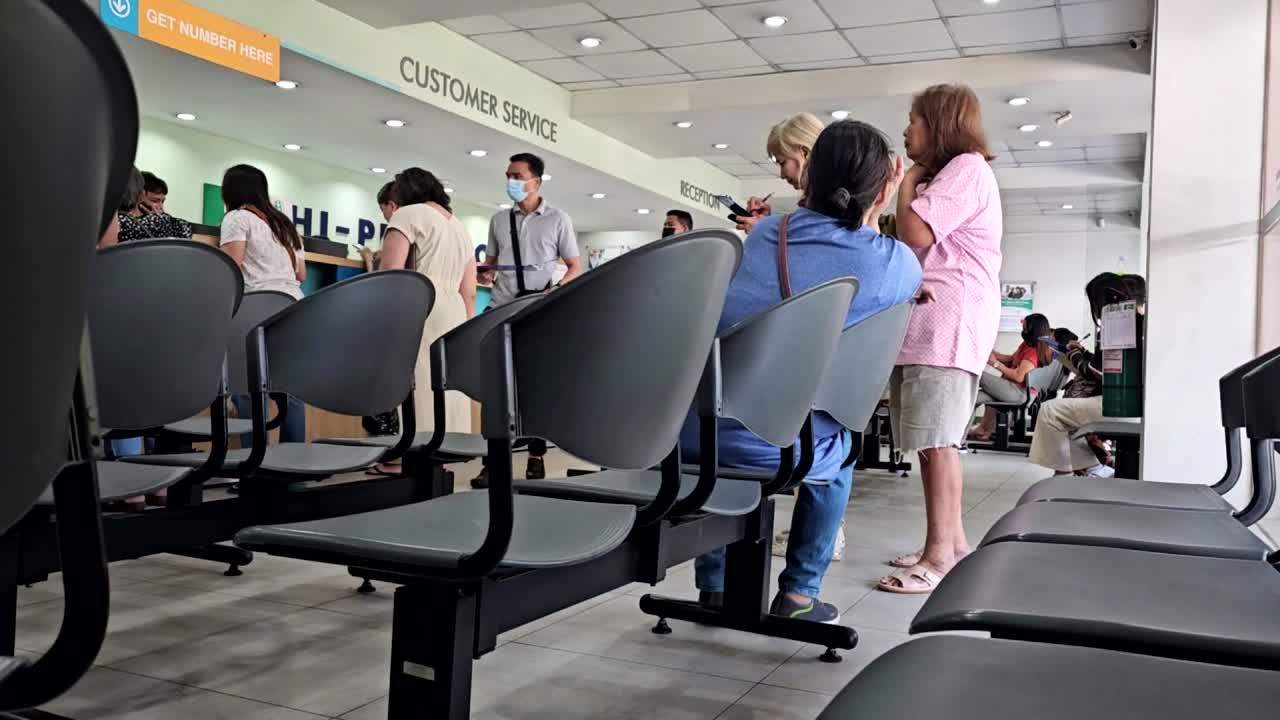 Line up of patients inside diagnostic clinic waiting for their turn.