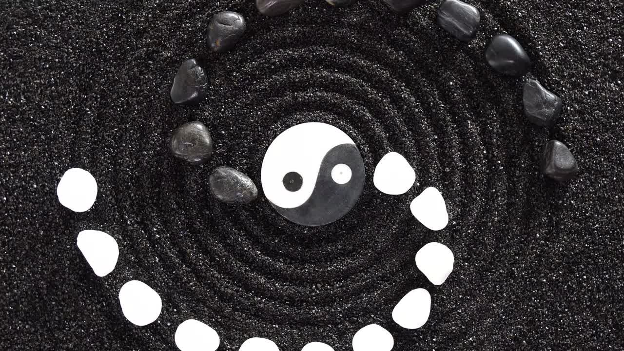 Japanese ZEN garden with yin yang stones in textured sand