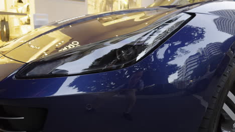 blue ferrari in the city