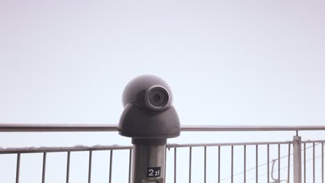 Rotating-telescope-on-observation-deck-on-misty-day,-Kasprowy-Wierch,-Poland