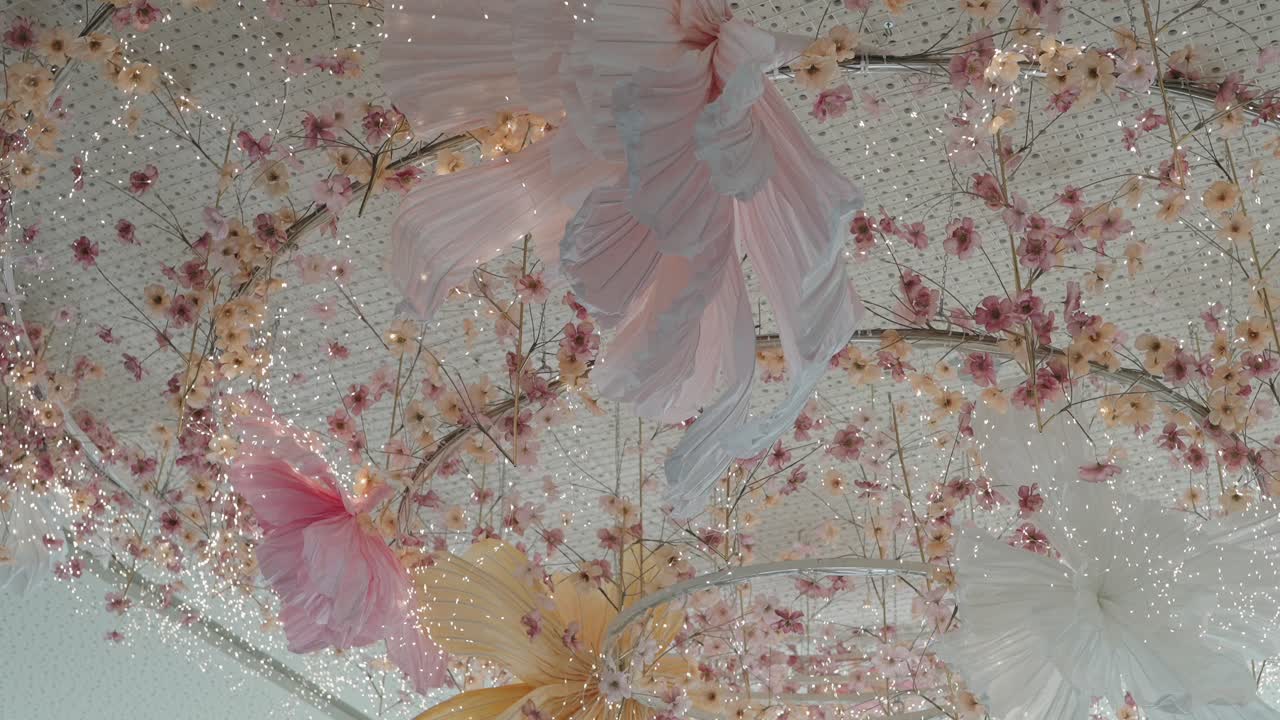 Floral ceiling decor with lights in an elegant venue