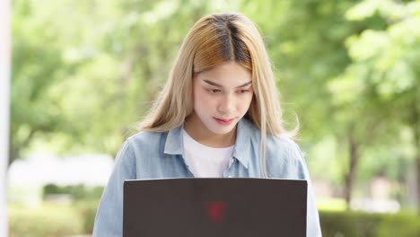 pretty asia girl student learning online using laptop computer