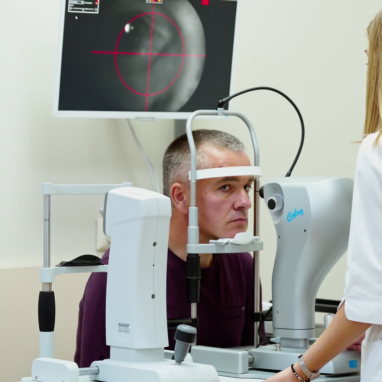 Elderly man examined by ophthalmologist