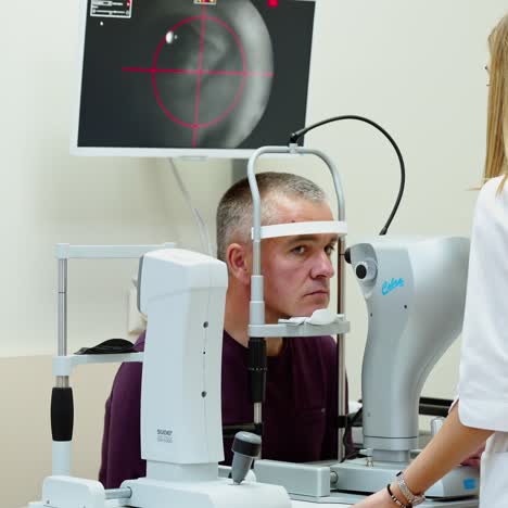 elderly man examined by ophthalmologist