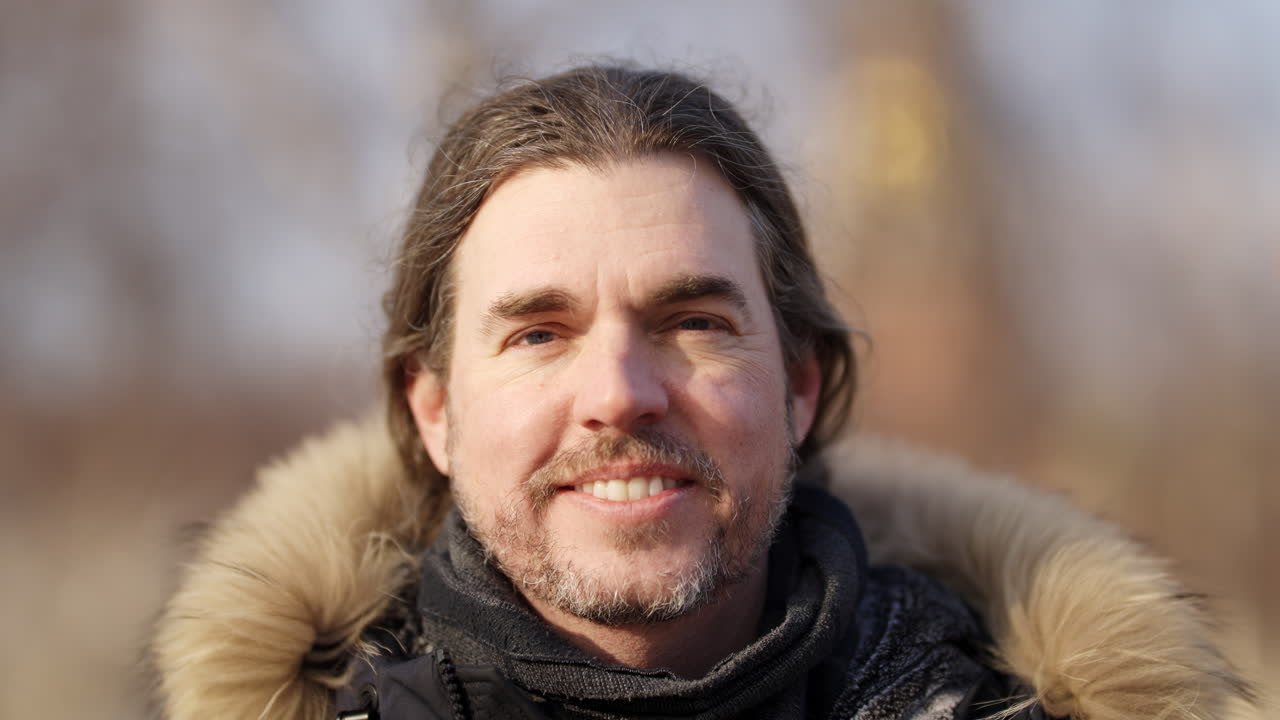 Portrait of a Smiling Man in Winter