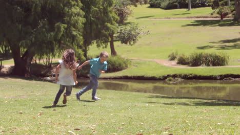 children playing football in a park