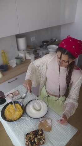 young woman baking in a kitchen