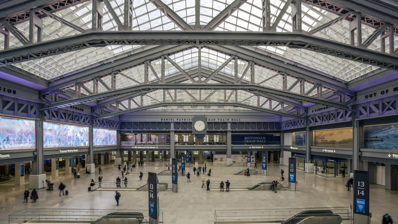 New York NY USA-January 8th, 2021 Visitors to the Daniel Patrick Moynihan Train Hall at Pennsylvania Station in New York enjoy the new space from the top level