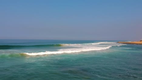 Flying-drone-over-the-Beach-Sea-shoreline-above-the-sea-and-sand-at-Durban-South-Africa