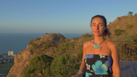 castle hill with woman on popular lookout over townsville in queensland, australia