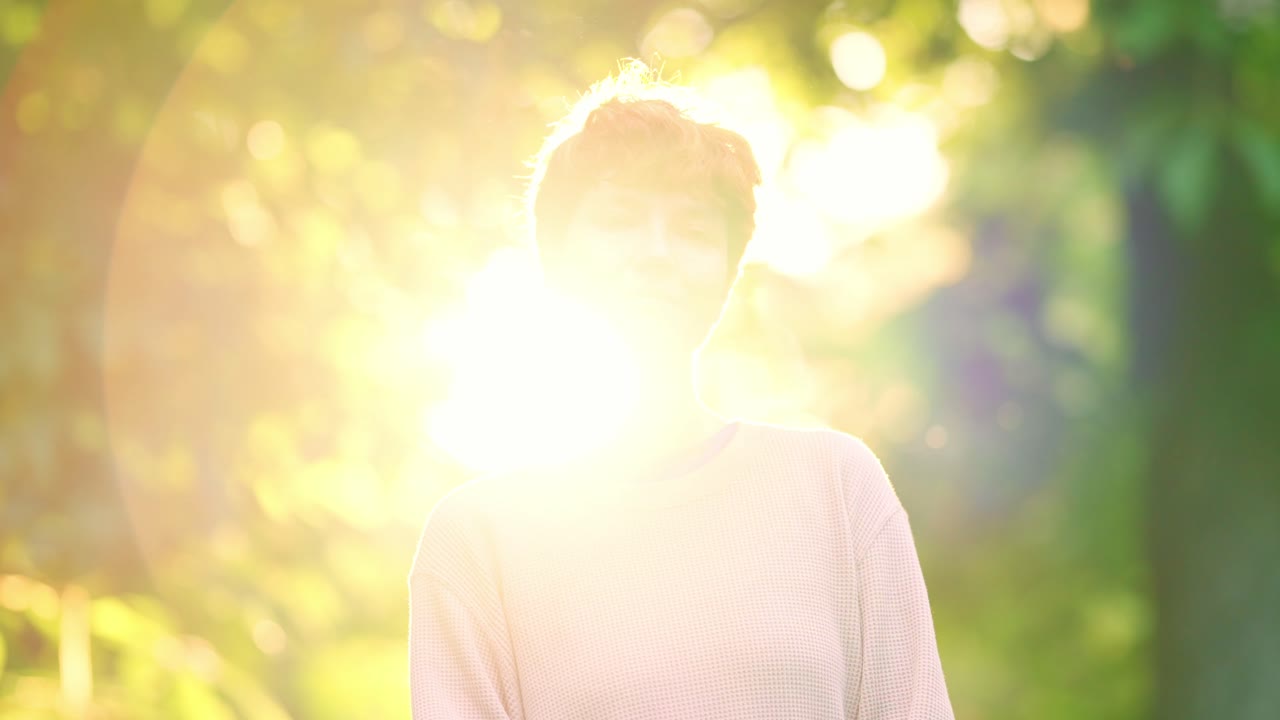 Portrait of a Woman with Red Hair in a Sunny Outdoor Setting