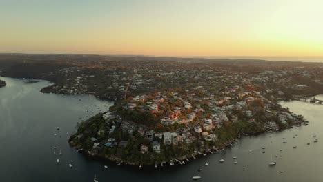 aerial view of waterfront houses at sunset