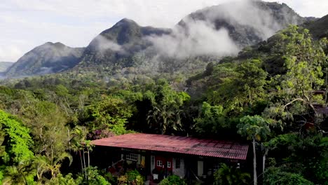 hacienda houses at valle de anton in central panama inside extinct volcano crater, aerial rising shot