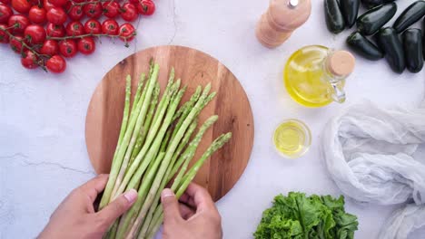 preparing a fresh asparagus and salad dish