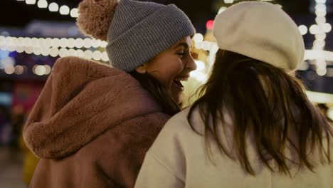 rear view video of woman walking together across christmas market