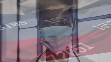 animación de la bandera de rusia y procesamiento de datos sobre la mujer médico afroamericana.