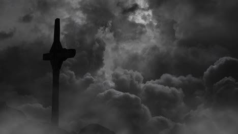 silhouette-of-a-cross-on-the-rocks-against-a-background-of-storm-clouds