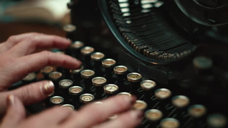 woman's hands typing on an isolate vintage underwood typewriter