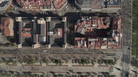 Top-down-footage-of-blocks-of-buildings-in-city.-Streets-surrounded-by-groups-of-multistorey-houses.-Barcelona,-Spain