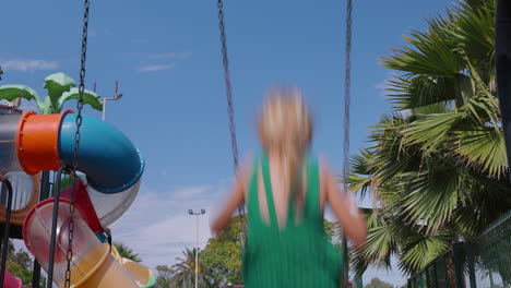 girl swinging on a playground