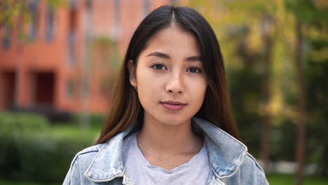 Outdoor-Portrait-Of-A-Beautiful-Japanese-Girl-Looking-And-Smiling-At-Camera-4