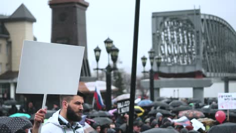 protest activist male with clear empty blank card board banner for advertising