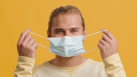 man wearing a mask, smiling