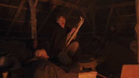 medieval music gathering by the fire