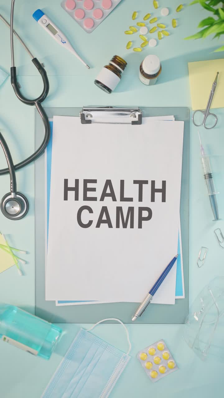 VERTICAL VIDEO OF HEALTH CAMP WRITTEN ON MEDICAL PAPER