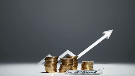 low-angle shot of stacked coins and a dollar bill, with an upward arrow symbolizing financial