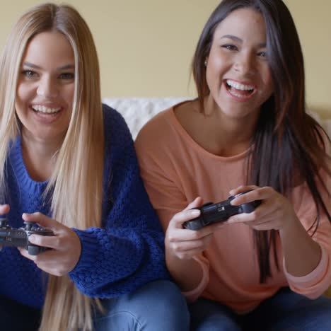 Excited-girls-playing-video-games-at-home