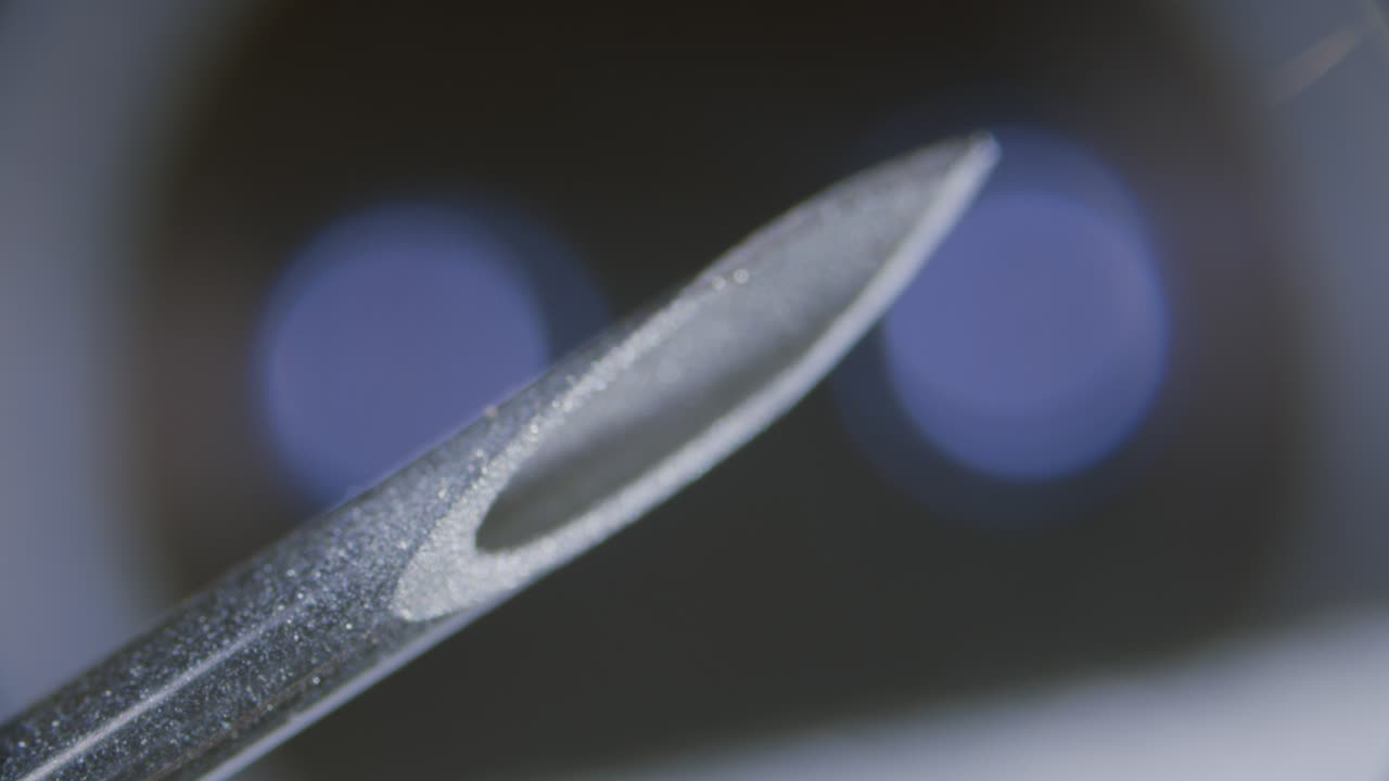 Syringe needle tip close-up under microscope