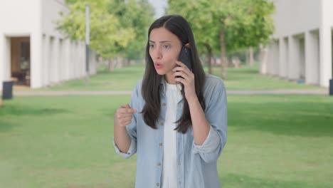 angry indian girl talking with someone on call