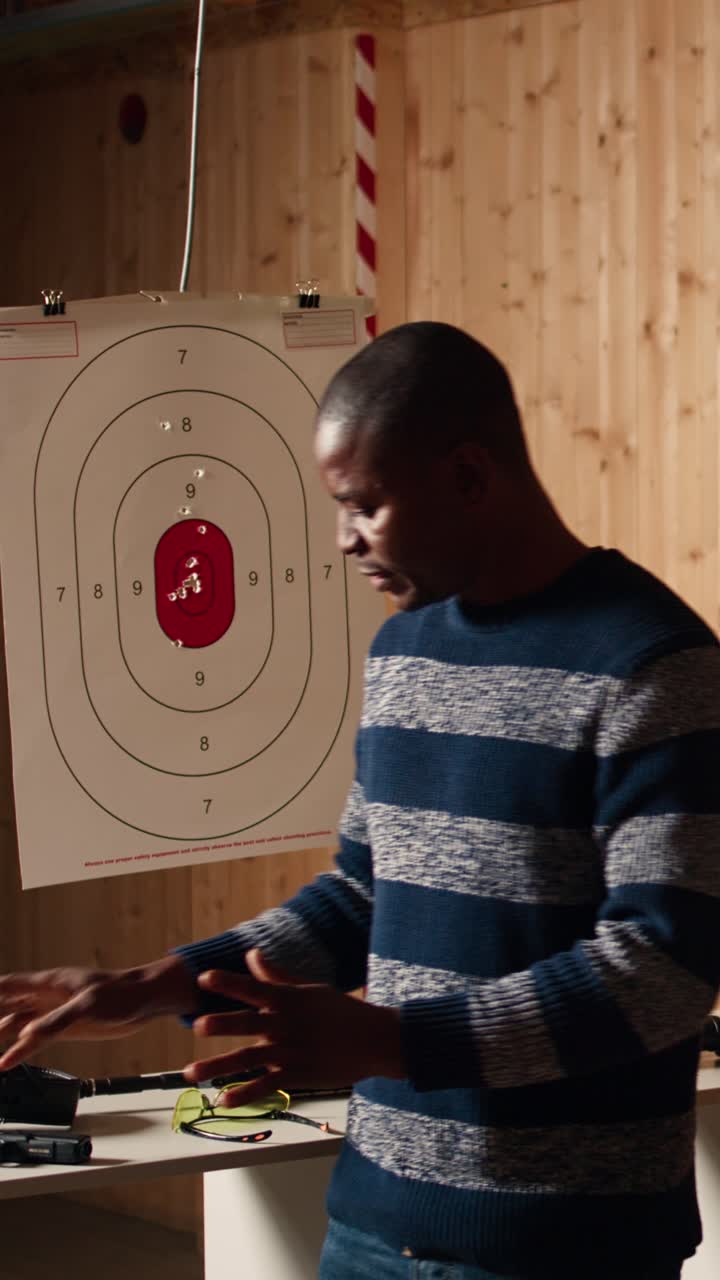 Vertical video Firing range expert welcoming clients, doing hand shake