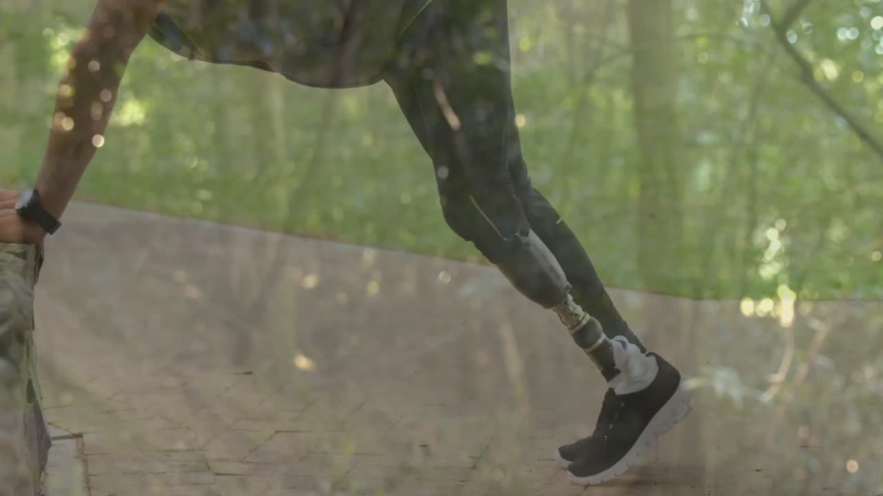 Animation of cityscape over disabled african american man with artificial leg stretching