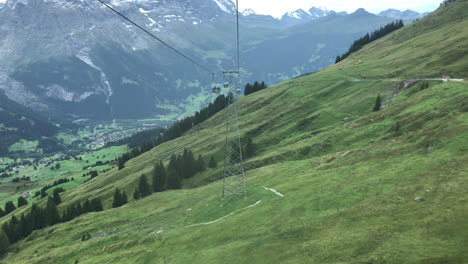 Beautiful-view-from-cable-car-moving-in-Grindelwald,-Switzerland