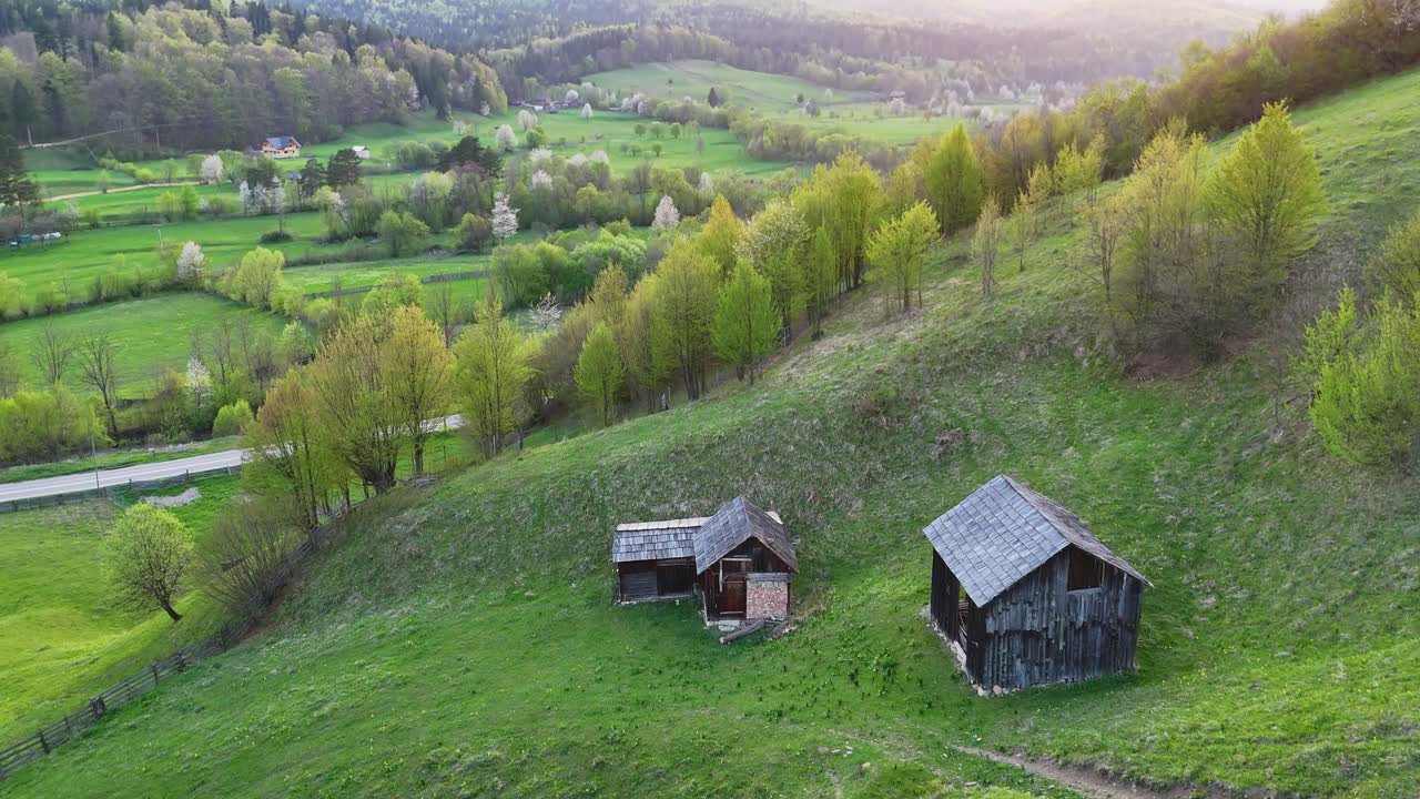 Scenic countryside with wooden houses near village