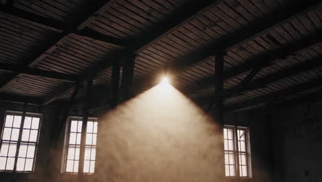 sunlight piercing an abandoned industrial building