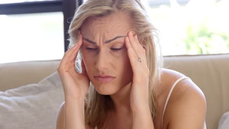 blonde women looking worried is seating