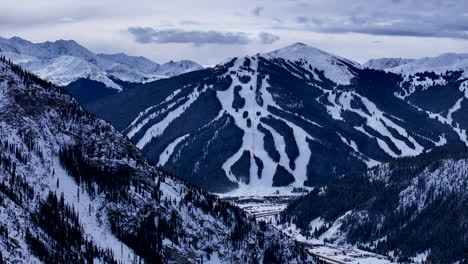 ski runs trails distant i70 copper mountain leadville colorado winter december christmas aerial drone cinematic landscape silverthorne vail aspen ten mile range cloudy rocky mountains right circle