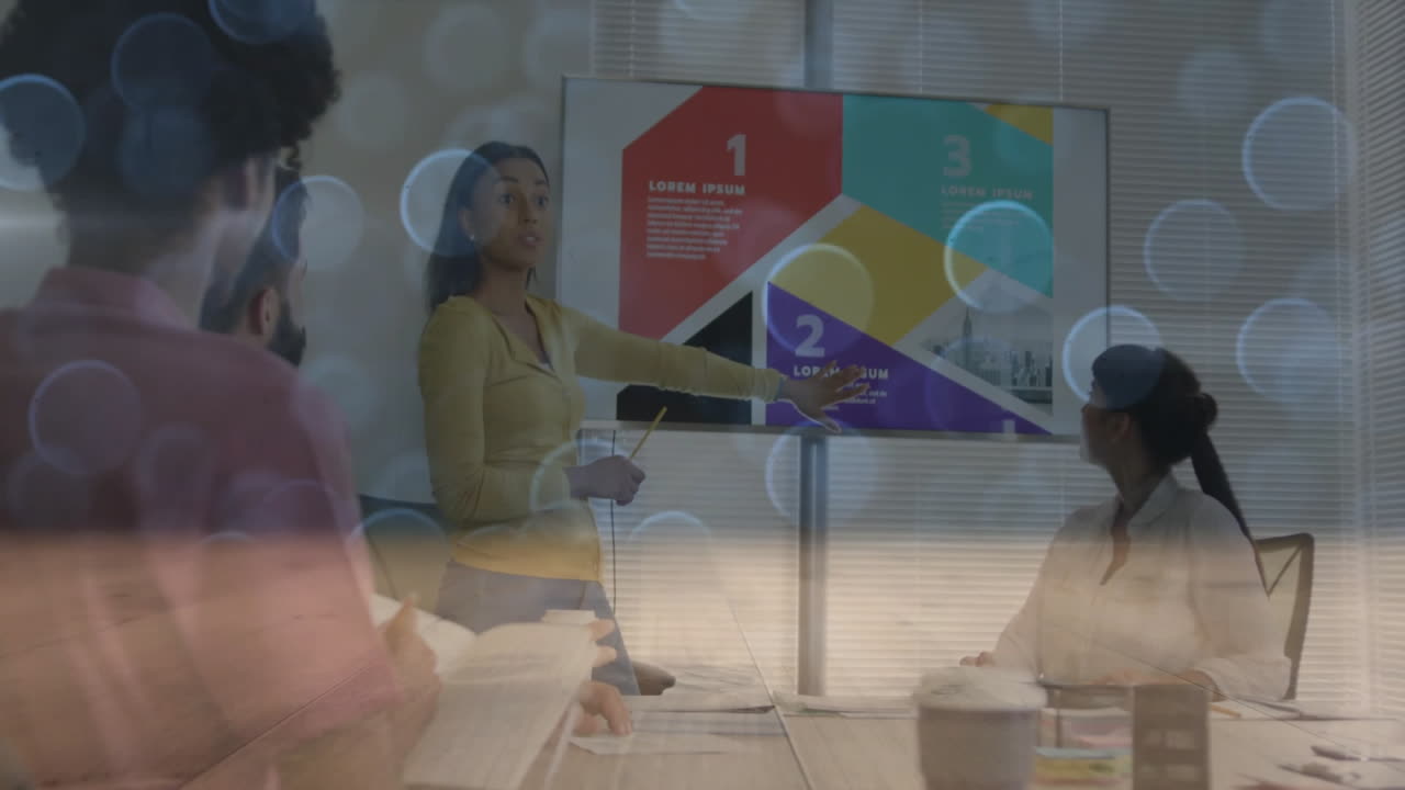 Business team delivering presentation in office, with animated infographic chart and bokeh lights