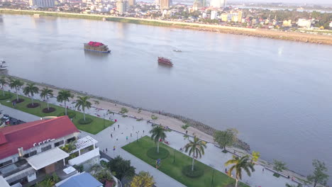 4k drone footage boat on tonle sap river in phnom penh, cambodia