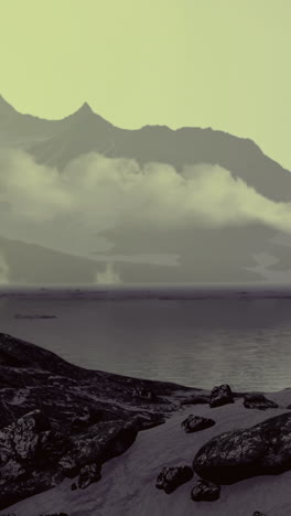 misty mountains rise above a tranquil lake under soft evening light