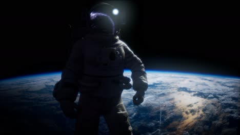 astronauta en el espacio exterior con el telón de fondo del planeta tierra. imagen de la tierra proporcionada por la nasa