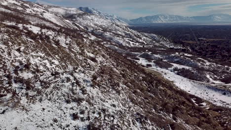 from the foothills looking down at an urban center in a wide valley - sliding camera movement